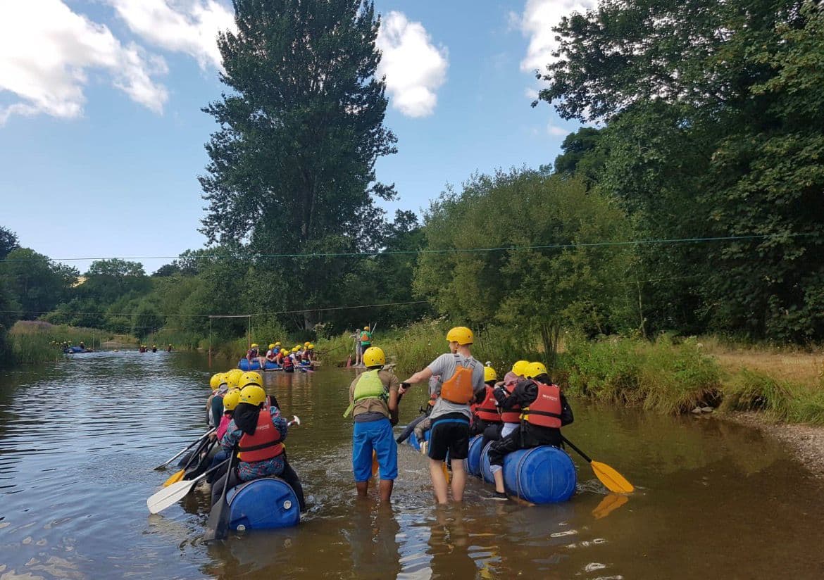 Young people working together during a water activity session